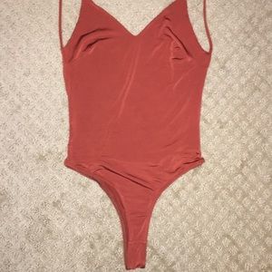 Orange open back body suit